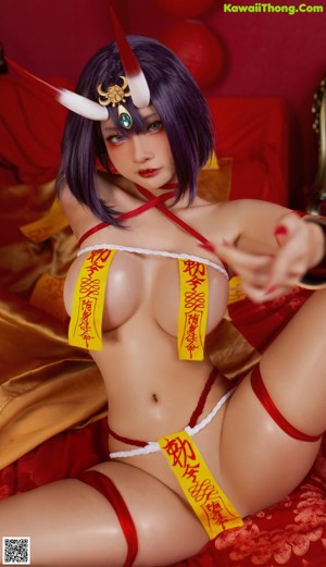 A woman in a red and yellow outfit is posing for a picture.