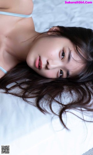 a woman wearing a blue bra and panties